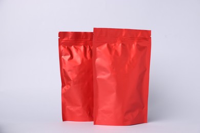 Photo of Zipper stand-up pouches on light grey background. Mockup for design
