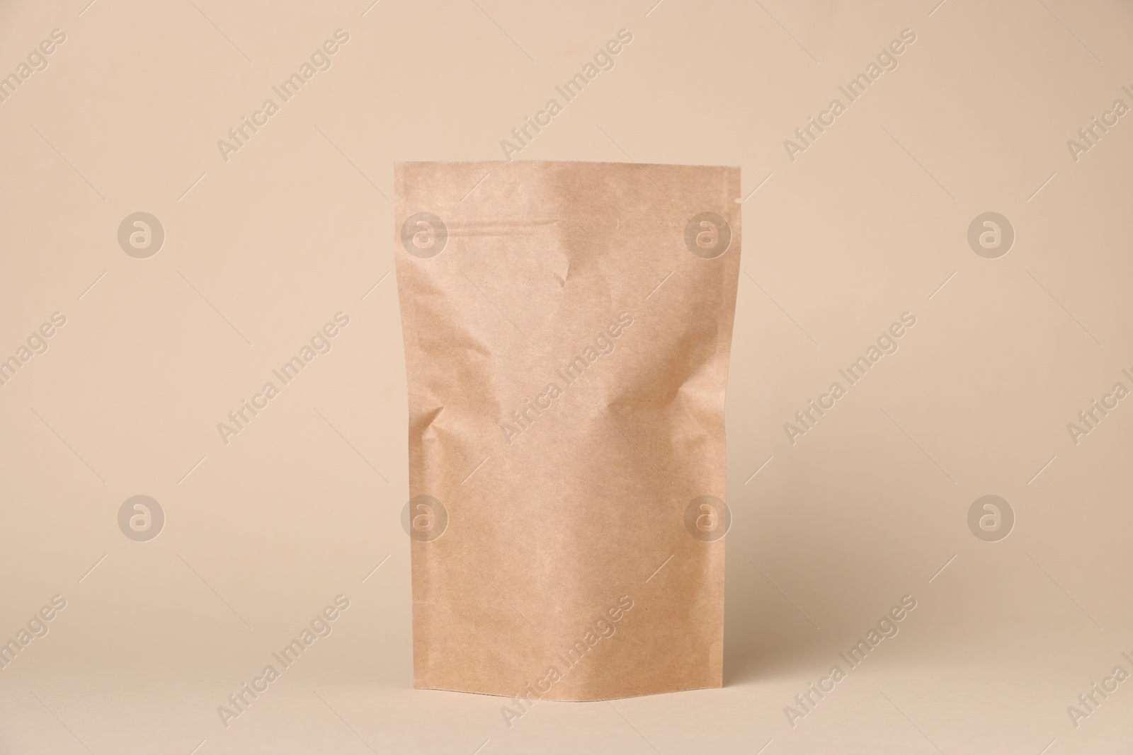 One zipper stand-up pouch on beige background. Mockup for design Photo of One zipper stand-up pouch on beige background. Mockup for design