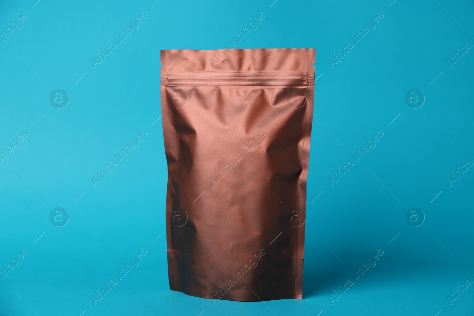 One zipper stand-up pouch on light blue background. Mockup for design Photo of One zipper stand-up pouch on light blue background. Mockup for design