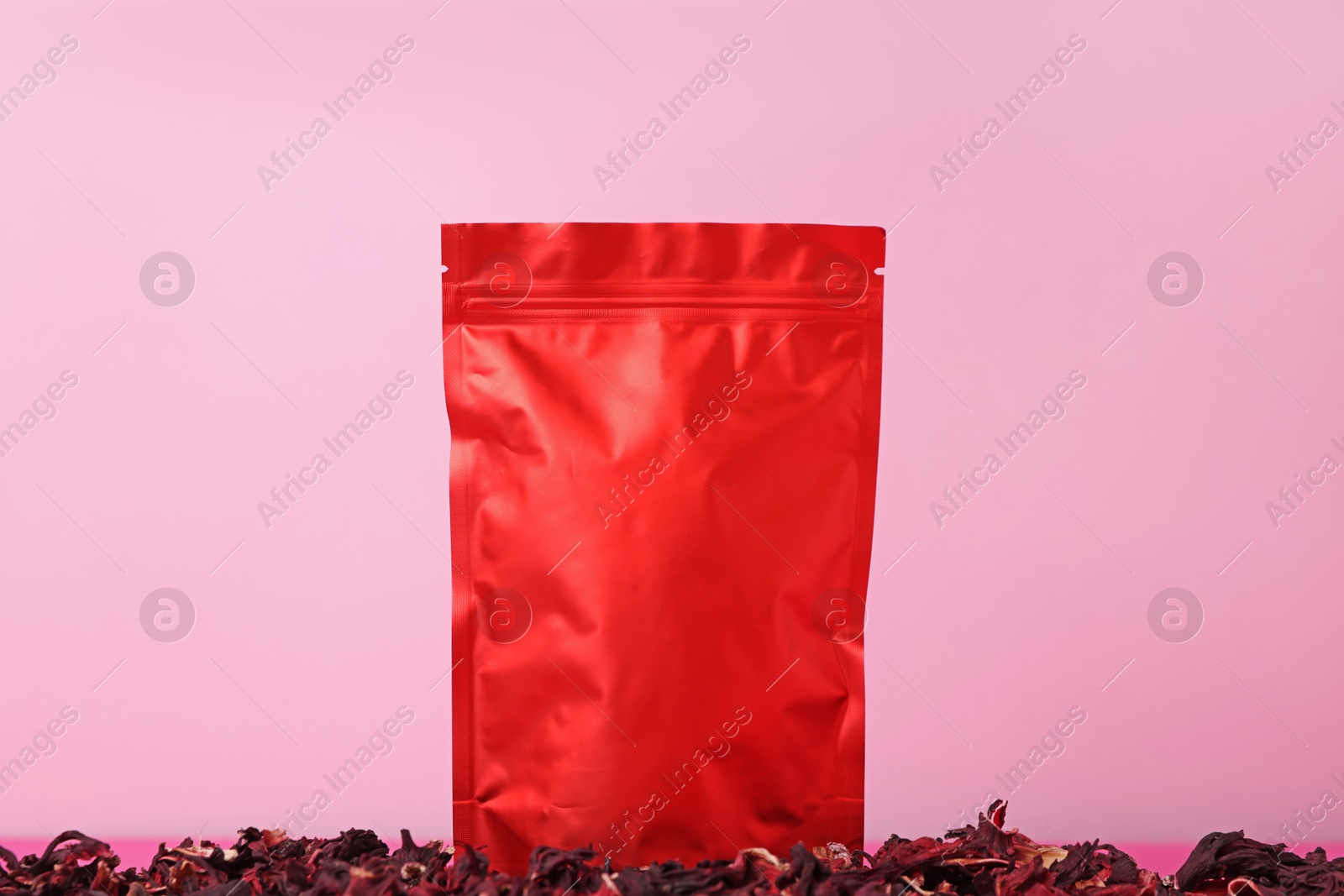 One zipper stand-up pouch with dry flowers on pink background. Mockup for design Photo of One zipper stand-up pouch with dry flowers on pink background. Mockup for design