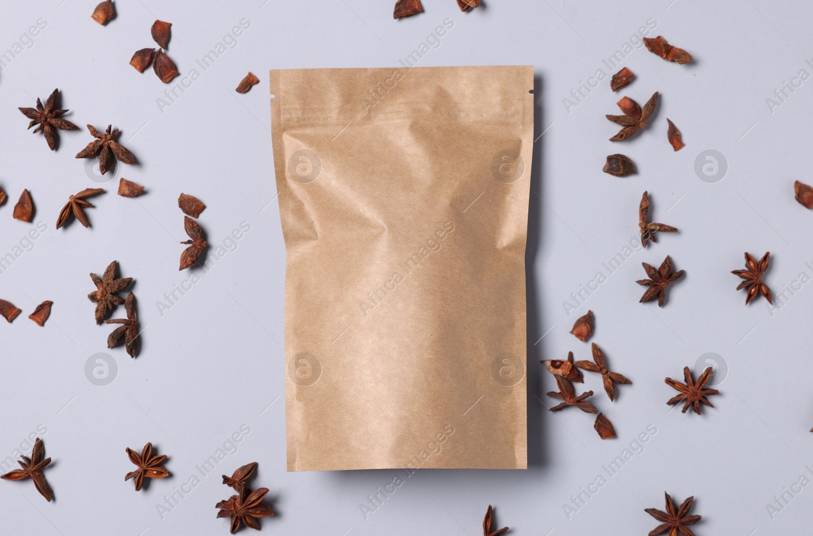 One zipper stand-up pouch with star anise on light grey background, flat lay. Mockup for design Photo of One zipper stand-up pouch with star anise on light grey background, flat lay. Mockup for design