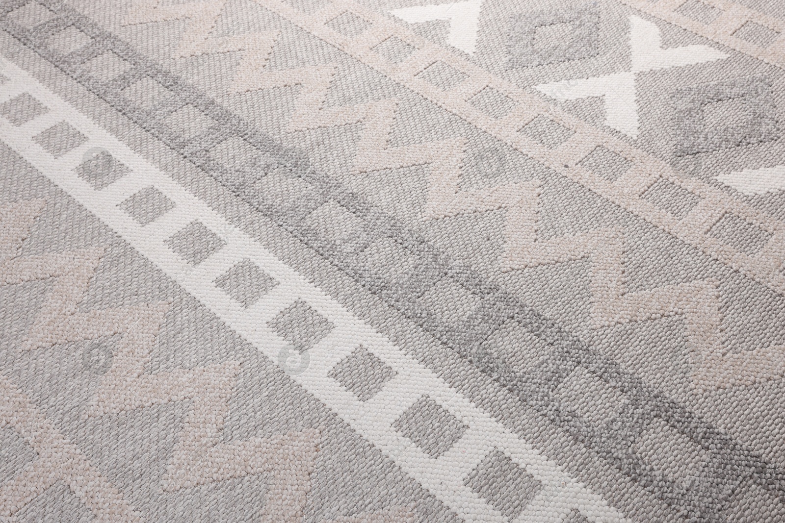 Stylish rug with pattern as background, closeup Photo of Stylish rug with pattern as background, closeup