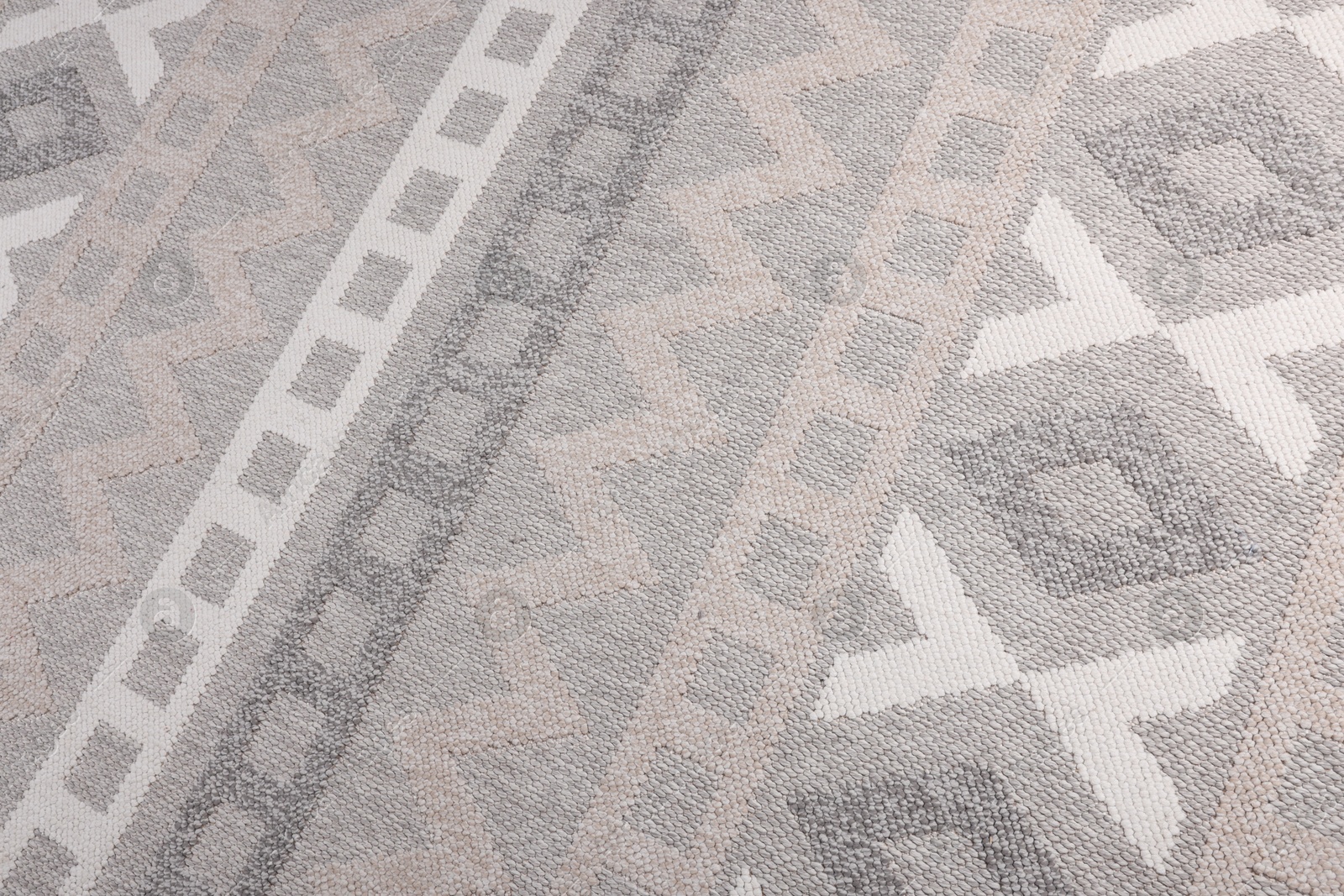 Stylish rug with pattern as background, closeup Photo of Stylish rug with pattern as background, closeup