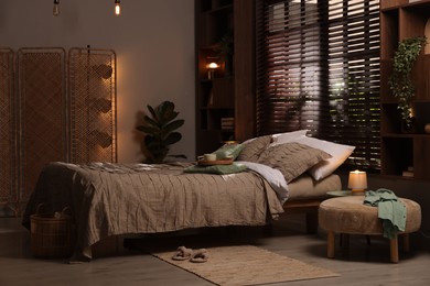 Photo of Comfortable bed with beautiful linens in bedroom
