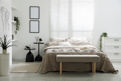 Photo of Comfortable bed with beautiful linens in bedroom
