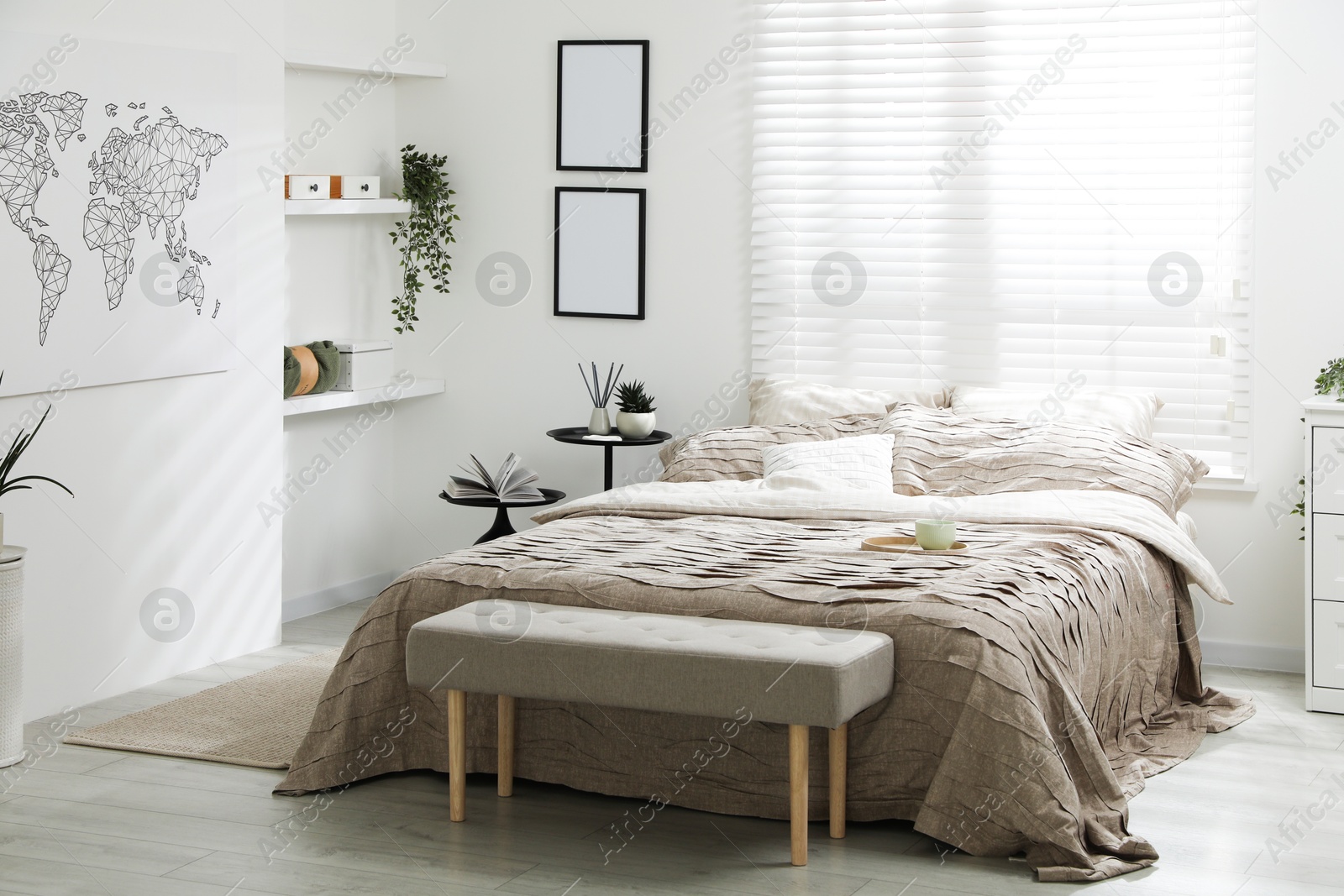 Photo of Comfortable bed with beautiful linens in bedroom