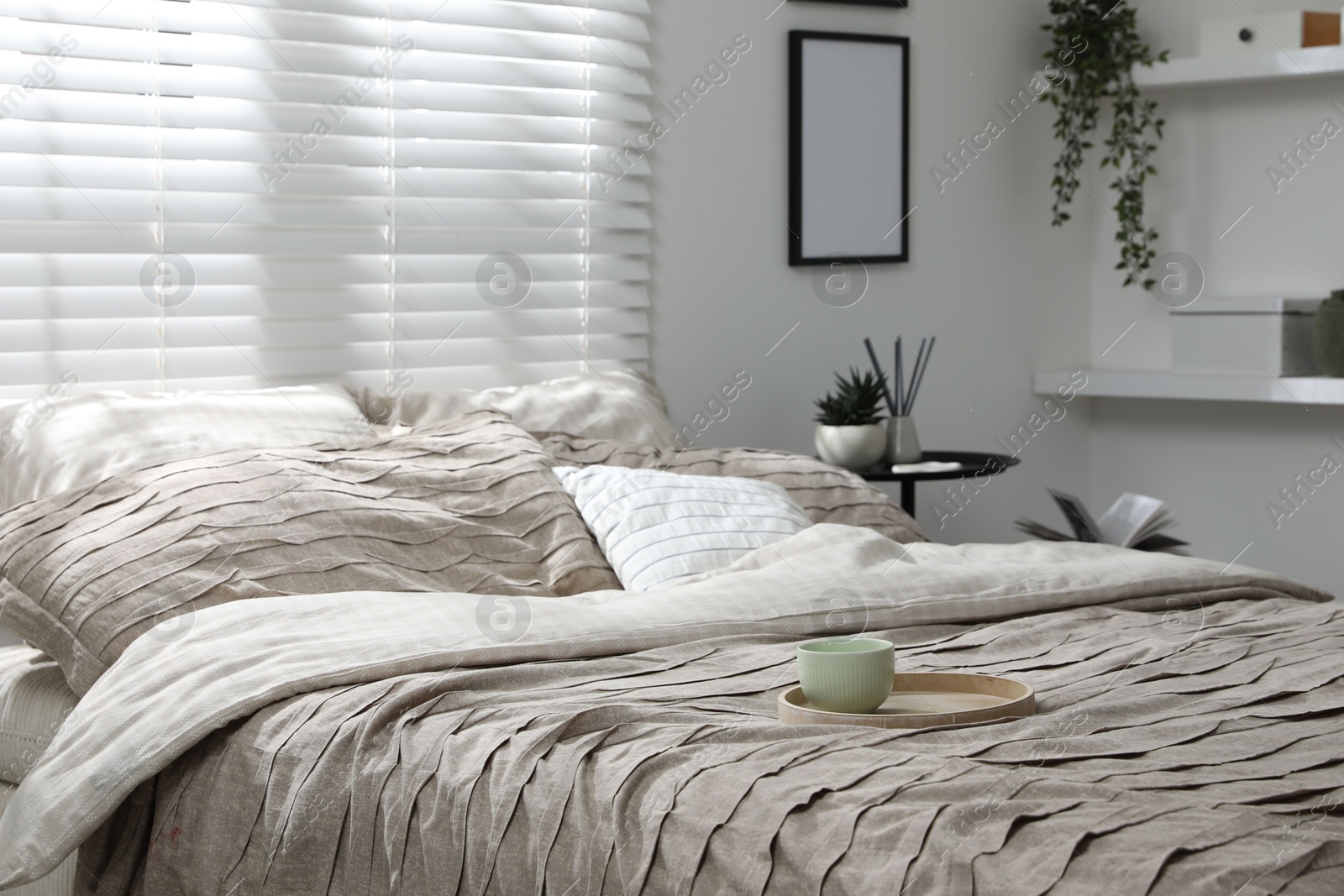 Photo of Comfortable bed with beautiful linens in bedroom
