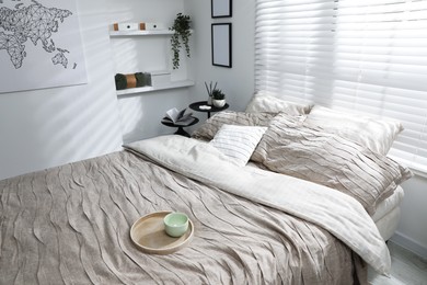 Photo of Comfortable bed with beautiful linens in bedroom, above view