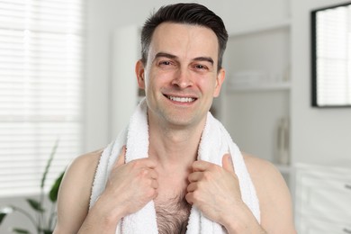 Photo of Portrait of smiling man after shaving at home