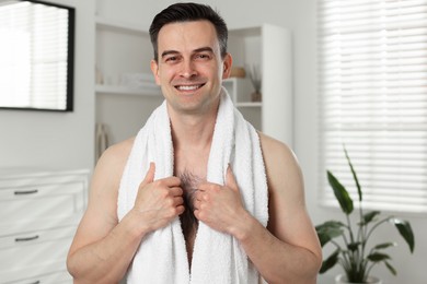 Photo of Portrait of smiling man after shaving at home