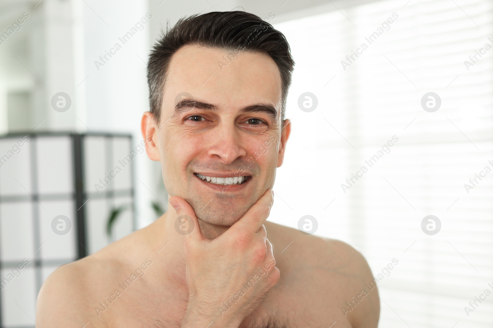 Smiling man after shaving at home, closeup Photo of Smiling man after shaving at home, closeup
