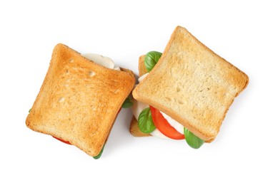 Photo of Tasty sandwiches with mozzarella cheese, tomatoes and basil on white background, top view