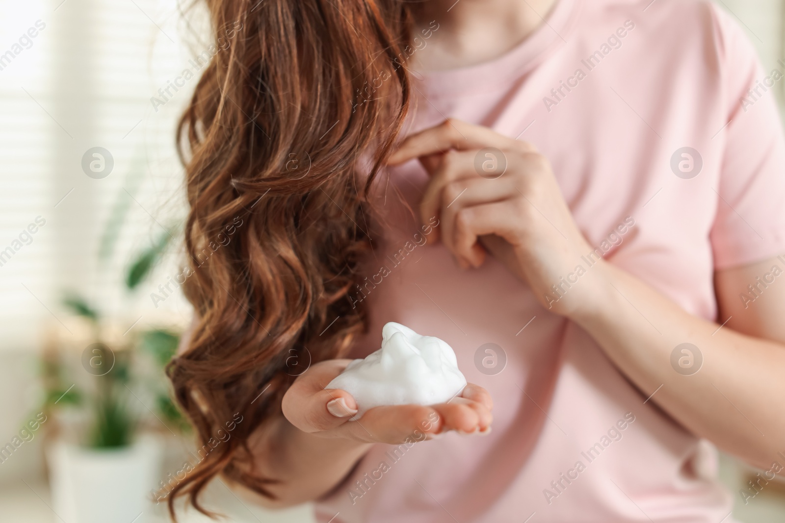 Teenage girl with hair mousse at home, closeup Photo of Teenage girl with hair mousse at home, closeup