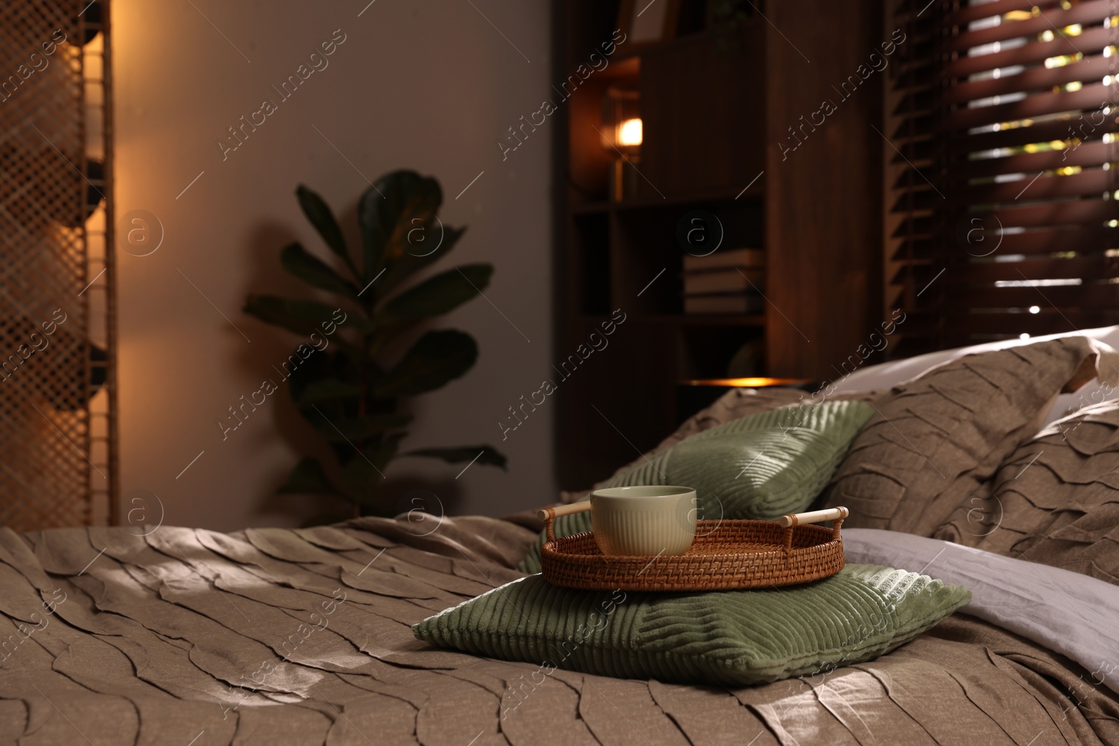 Photo of Comfortable bed with beautiful linens in bedroom