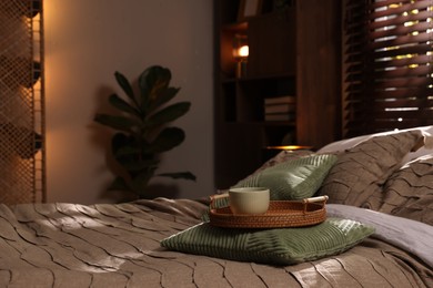 Photo of Comfortable bed with beautiful linens in bedroom