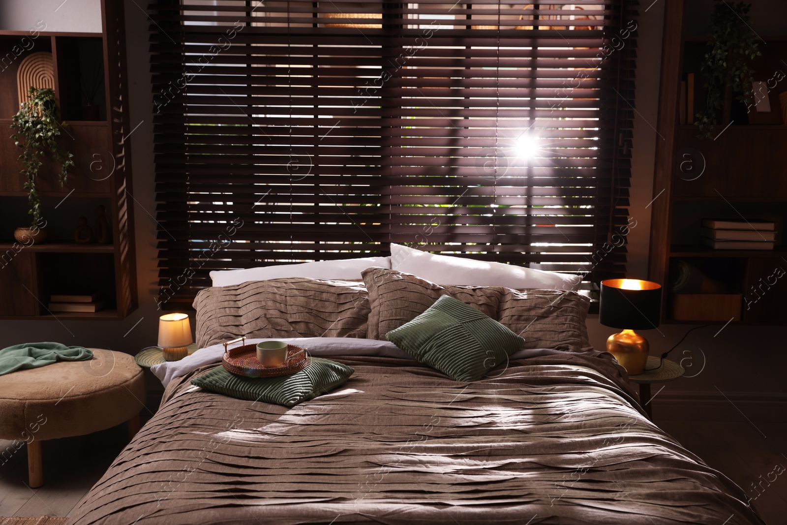 Photo of Comfortable bed with beautiful linens in bedroom