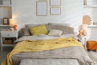 Photo of Comfortable bed with beautiful linens in bedroom