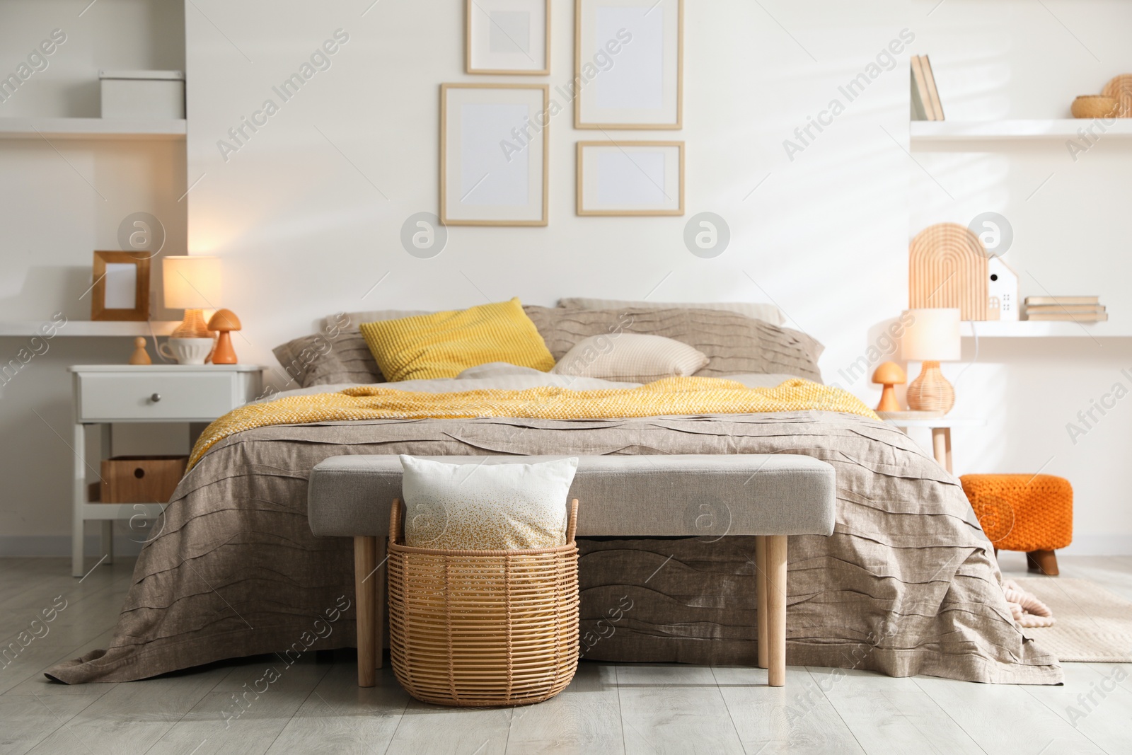 Photo of Comfortable bed with beautiful linens in bedroom