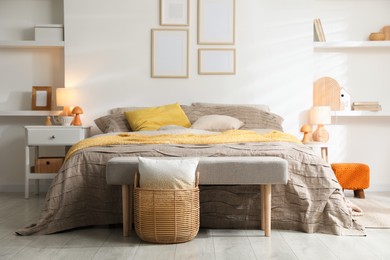 Photo of Comfortable bed with beautiful linens in bedroom