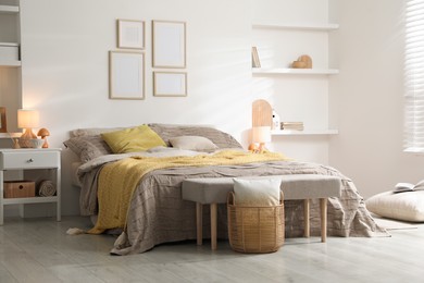 Photo of Comfortable bed with beautiful linens in bedroom