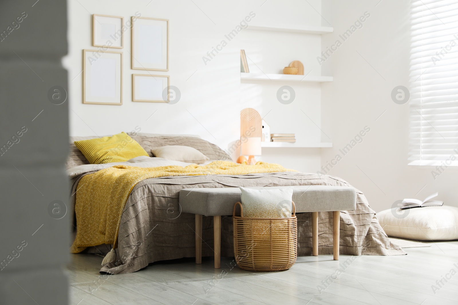 Photo of Comfortable bed with beautiful linens in bedroom