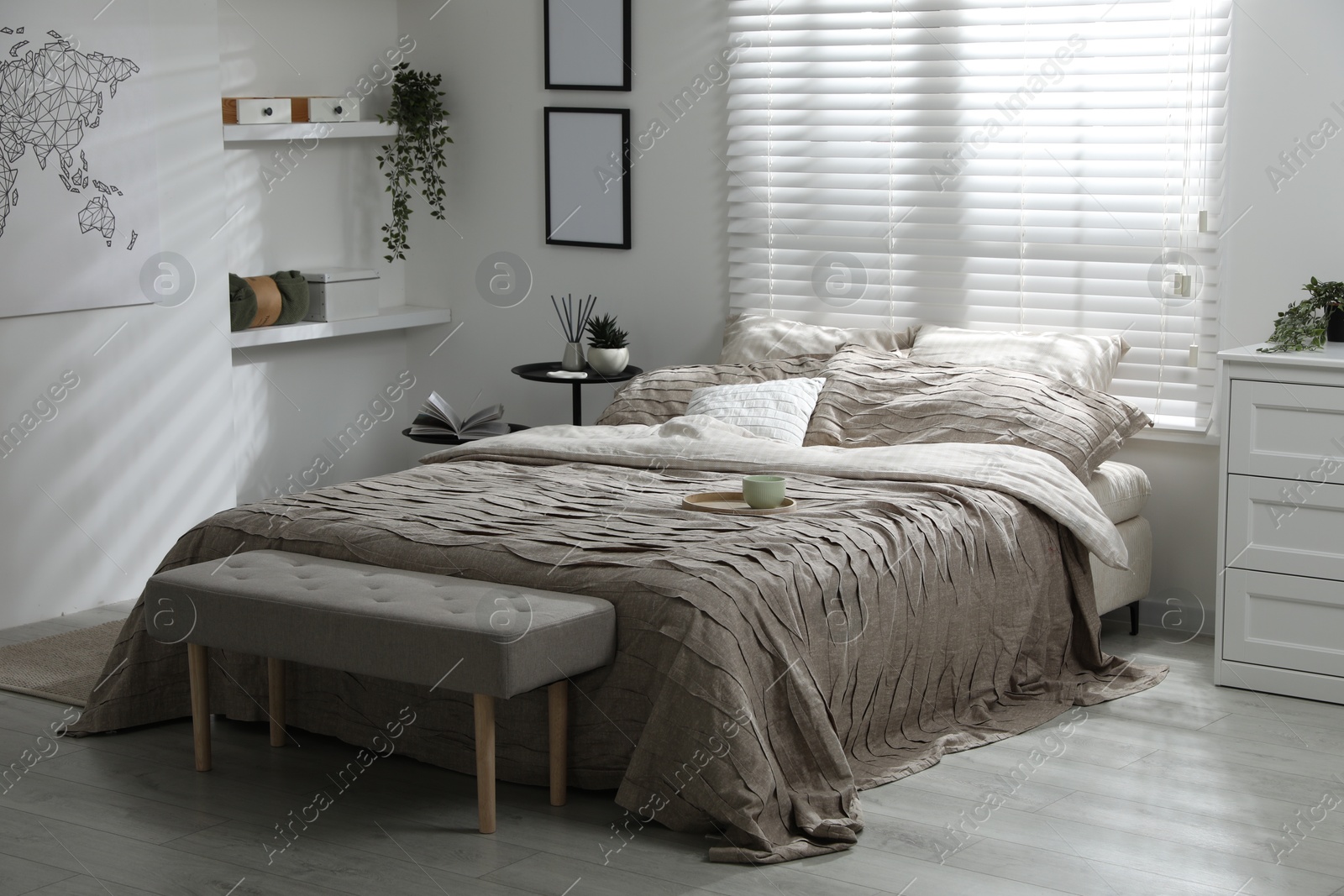 Photo of Comfortable bed with beautiful linens in bedroom