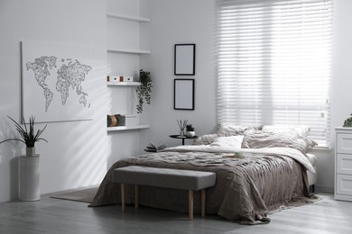 Photo of Comfortable bed with beautiful linens in bedroom