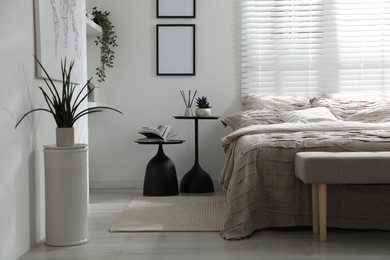Photo of Comfortable bed with beautiful linens in bedroom