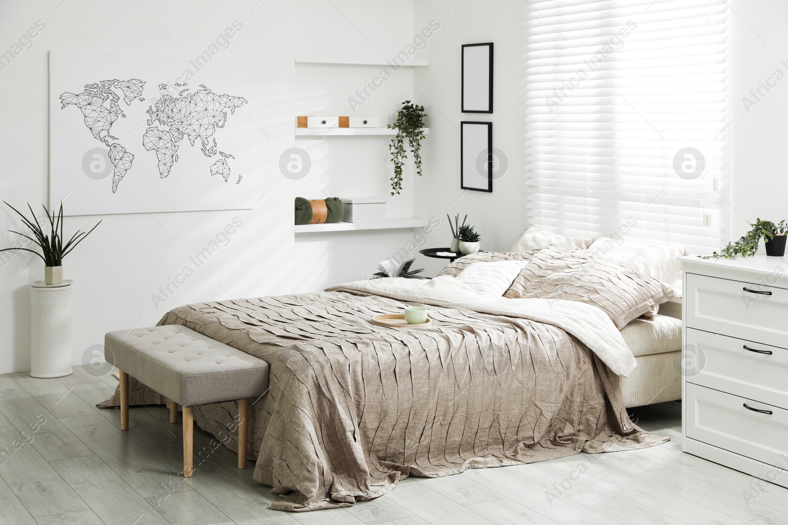 Photo of Comfortable bed with beautiful linens in bedroom