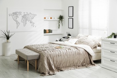 Photo of Comfortable bed with beautiful linens in bedroom