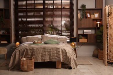 Photo of Comfortable bed with beautiful linens in bedroom