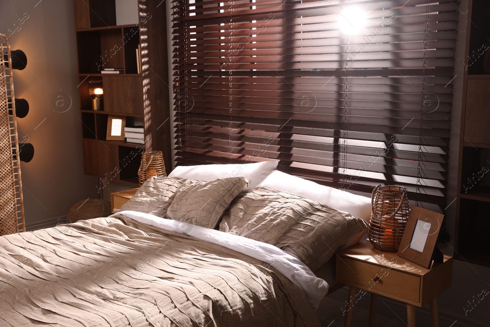 Photo of Comfortable bed with beautiful linens in bedroom