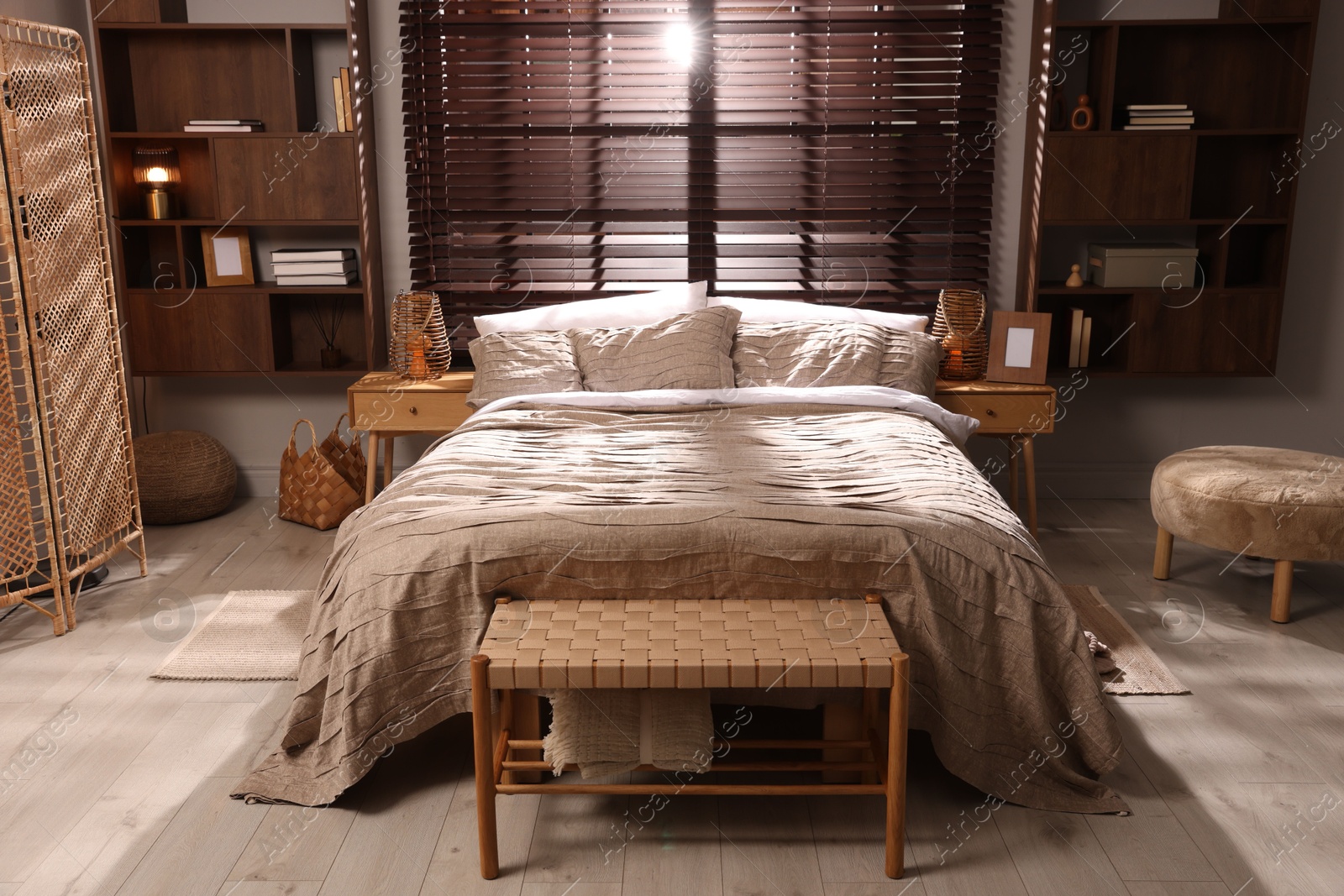 Photo of Comfortable bed with beautiful linens in bedroom