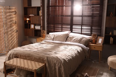 Photo of Comfortable bed with beautiful linens in bedroom