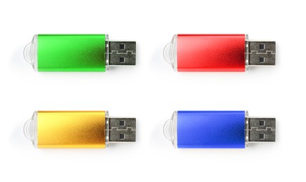 Image of Colorful flash drives isolated on white, collage. Top view