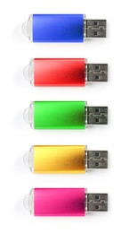 Image of Colorful flash drives isolated on white, collage. Top view