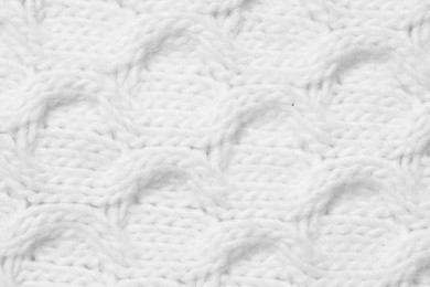 Image of Texture of white knitted fabric with pattern as background, top view