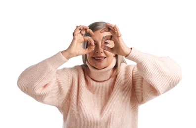Photo of Senior woman wearing different rings on white background