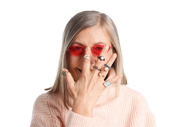 Photo of Senior woman wearing different rings and sunglasses on white background