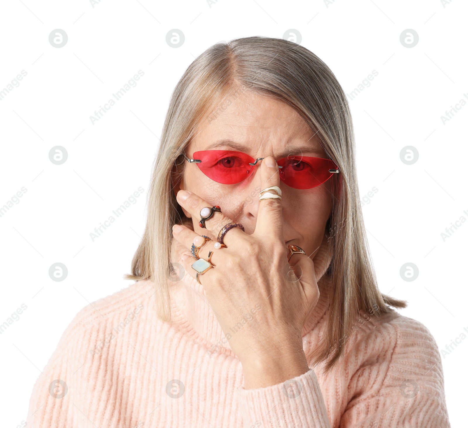 Photo of Senior woman wearing different rings and sunglasses on white background