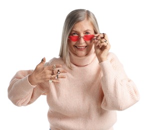 Photo of Senior woman wearing different rings and sunglasses on white background