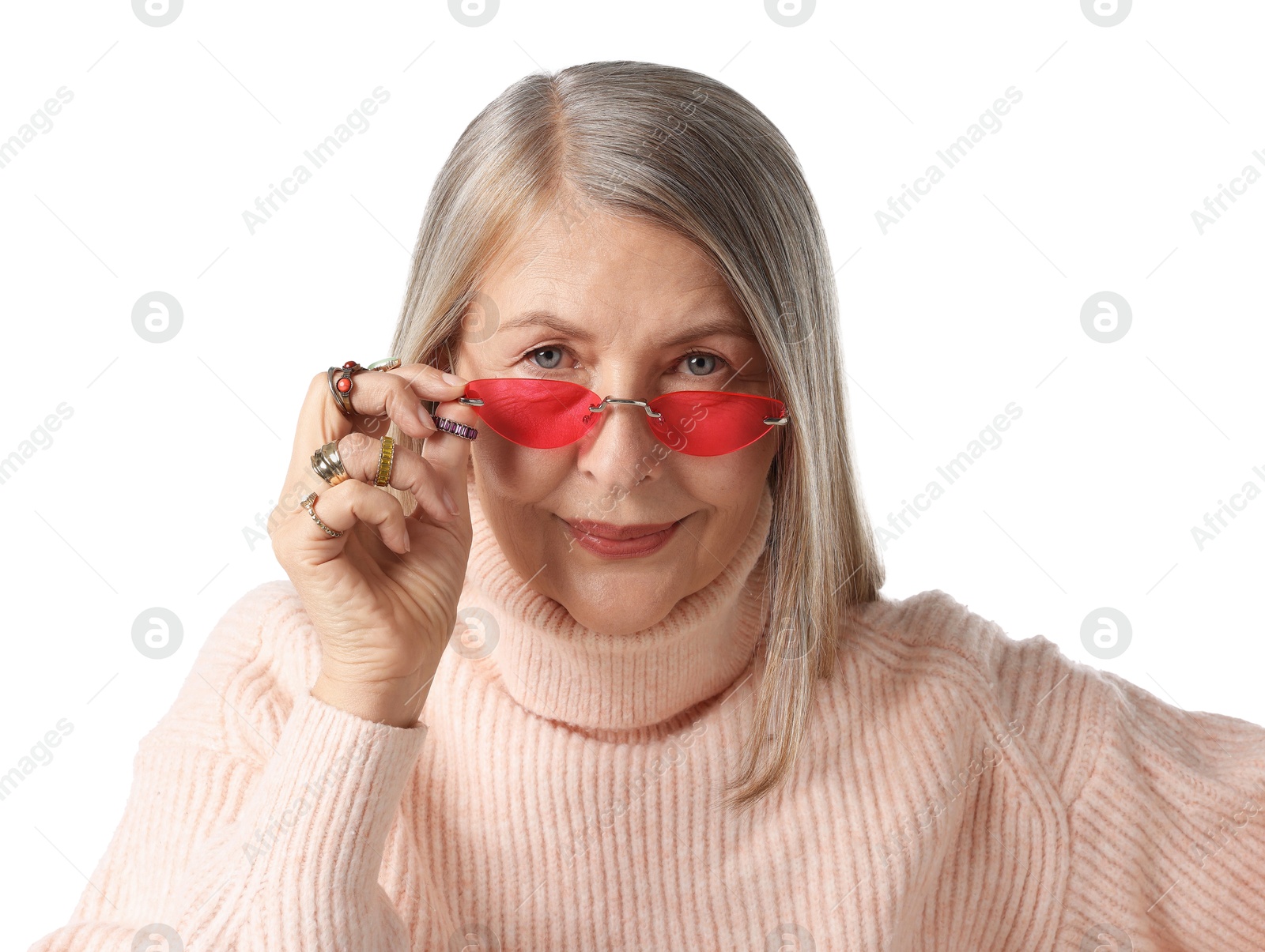 Photo of Senior woman wearing different rings and sunglasses on white background