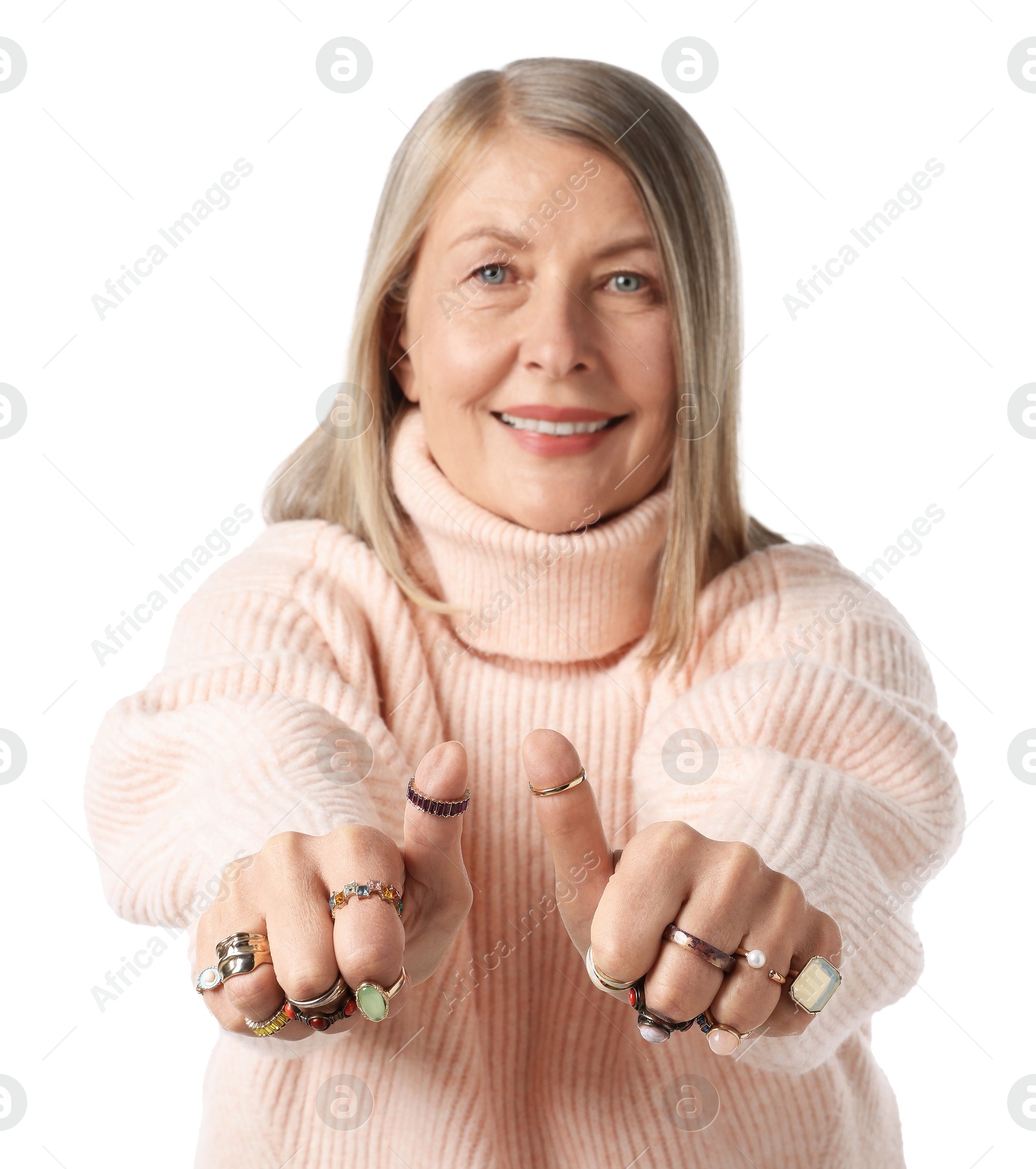 Senior woman wearing different rings and showing thumbs up on white background Photo of Senior woman wearing different rings and showing thumbs up on white background