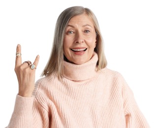 Photo of Senior woman wearing different rings and making rock gesture on white background