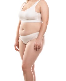 Photo of Weight loss. Plus size woman in underwear on white background, closeup