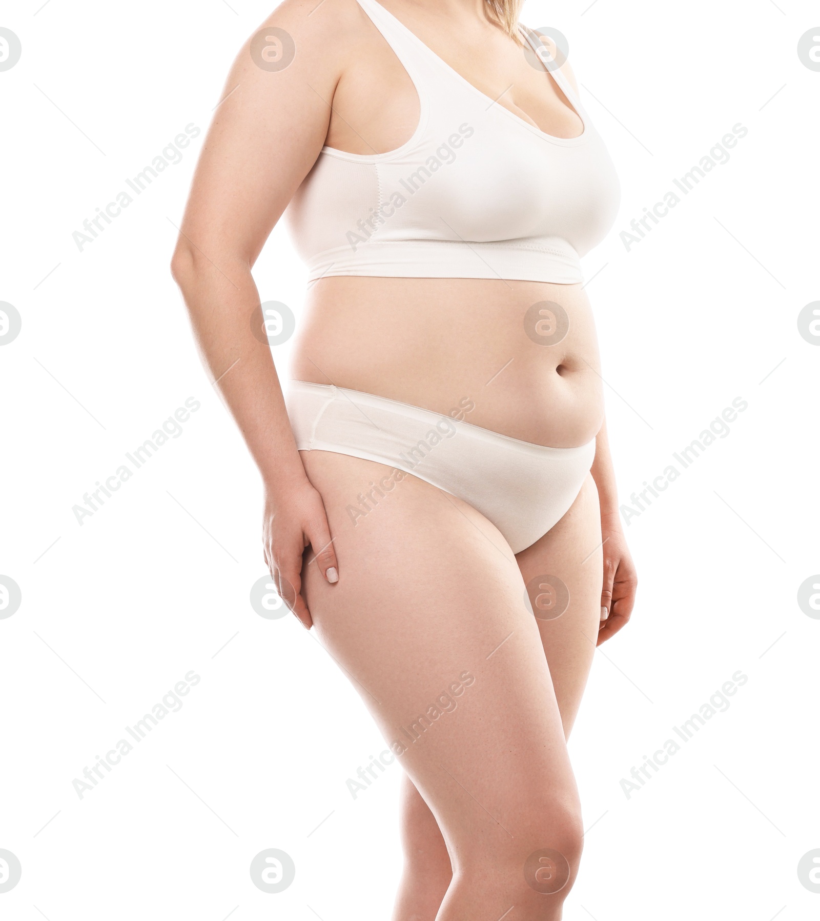 Weight loss. Plus size woman in underwear on white background, closeup Photo of Weight loss. Plus size woman in underwear on white background, closeup