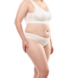 Photo of Weight loss. Plus size woman in underwear on white background, closeup