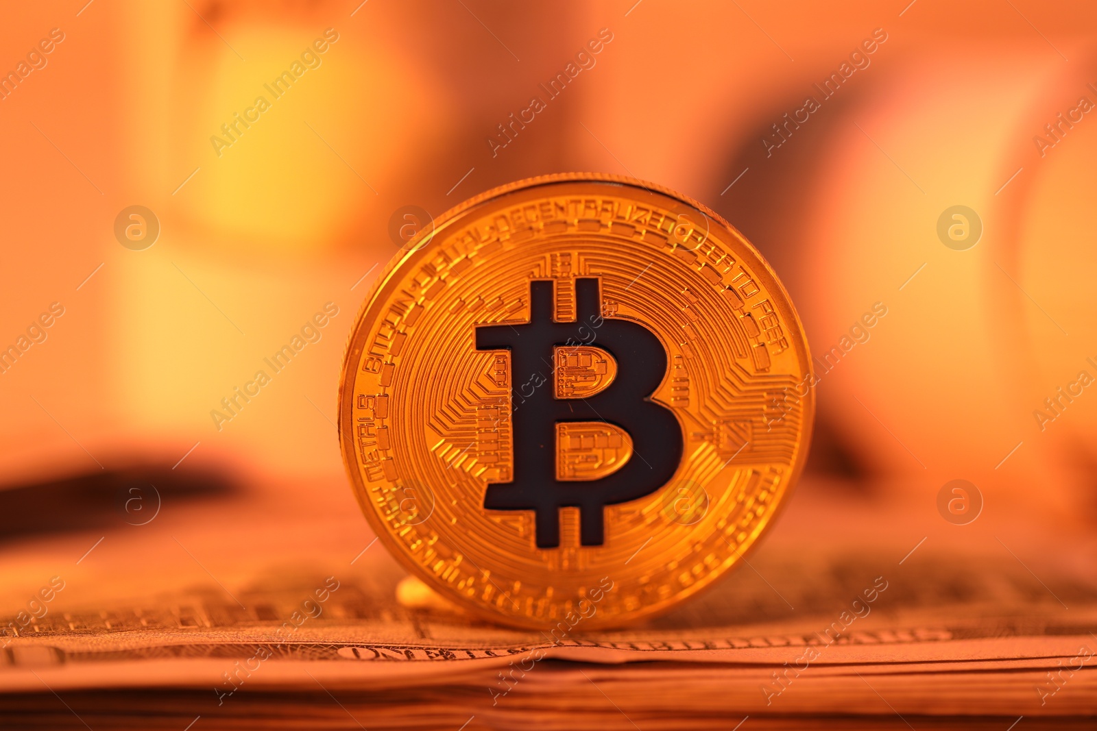 Cryptocurrency. Bitcoin and dollar banknote on table, closeup Photo of Cryptocurrency. Bitcoin and dollar banknote on table, closeup