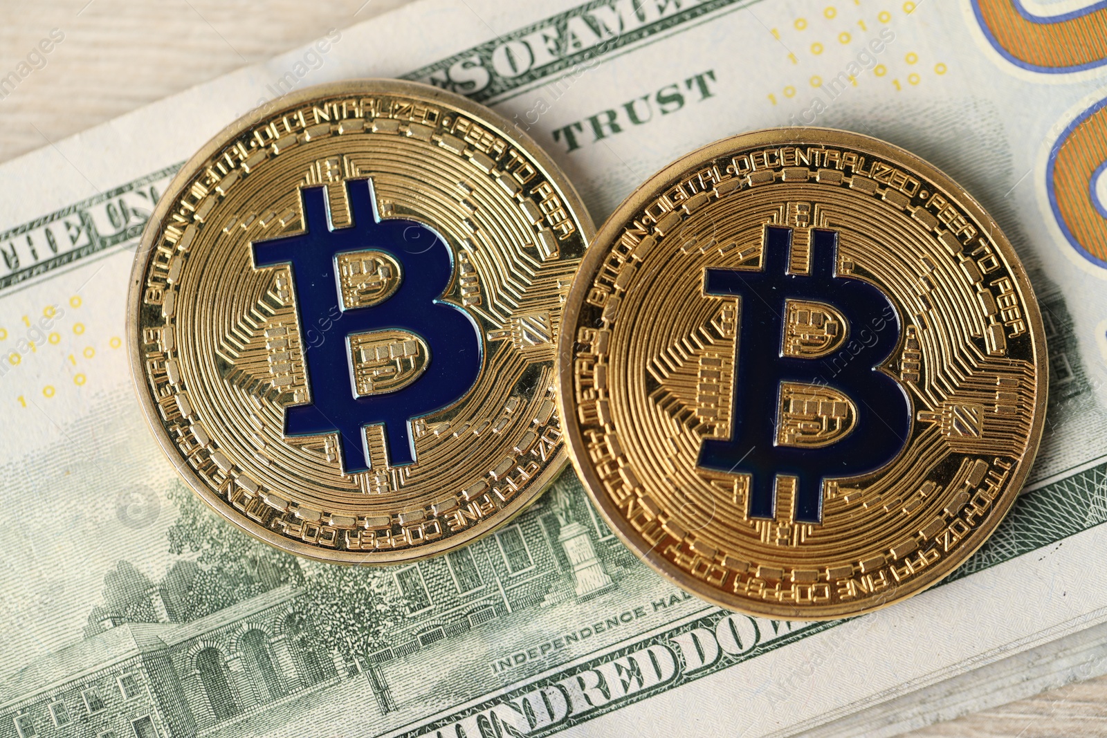 Cryptocurrency. Bitcoins and dollar banknote on table, top view Photo of Cryptocurrency. Bitcoins and dollar banknote on table, top view
