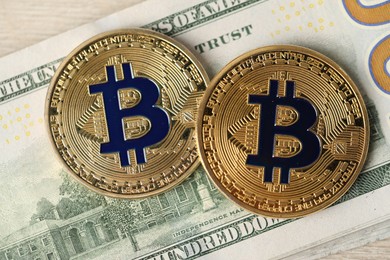 Photo of Cryptocurrency. Bitcoins and dollar banknote on table, top view